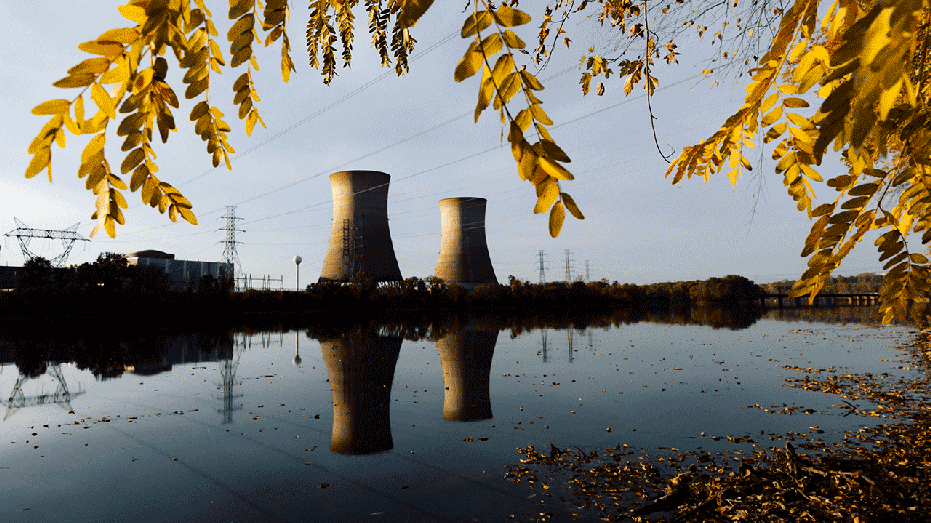 Two massive cooling towers being rehabilitated for nuclear power generation under Microsoft at Crane Clean Energy Center, previously known as Three Mile Island, can be seen from across the Susquehanna River on Wednesday, Oct. 30, 2024 in Middletown, PA. (Photos by Wesley Lapointe for The Washington Post via Getty Images)