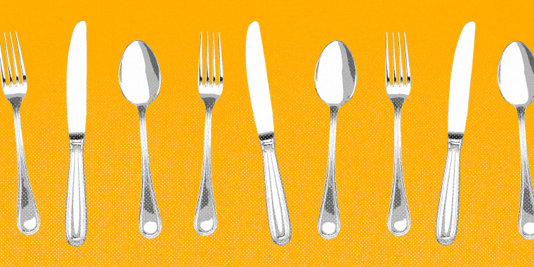 Forks, knives, and spoons lined up against a yellow background.