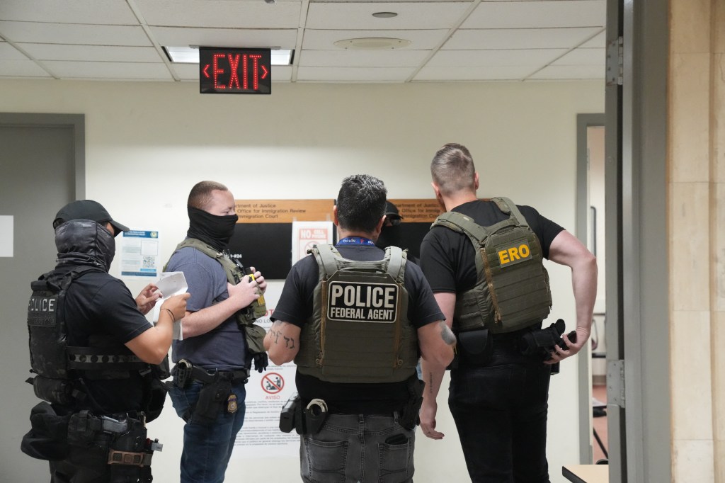 ICE agents in a courthouse.